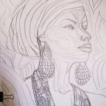 A sketch of an African woman in a hair wrap wearing earrings and a necklace.